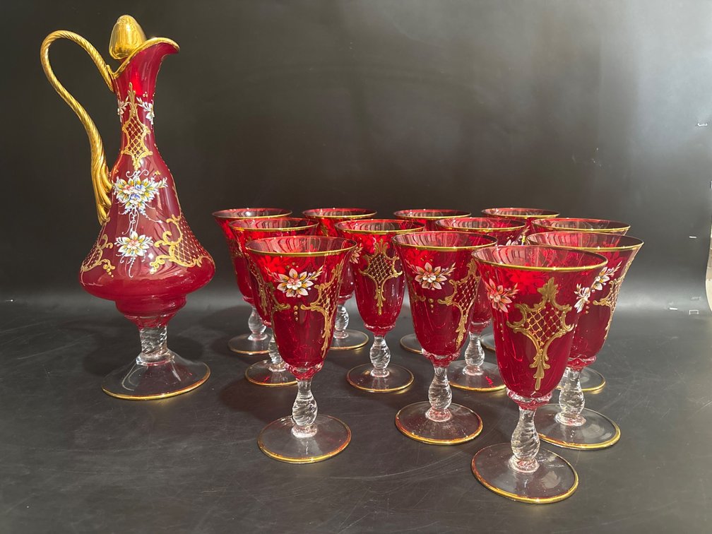 Ruby Red Glass Pitcher with 12 Matching Stemware Pieces Featuring Hand-Painted Floral Design