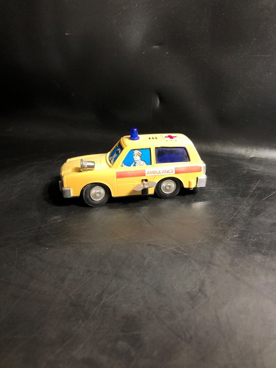 Yellow Toy Ambulance with Red Cross and Blue Siren