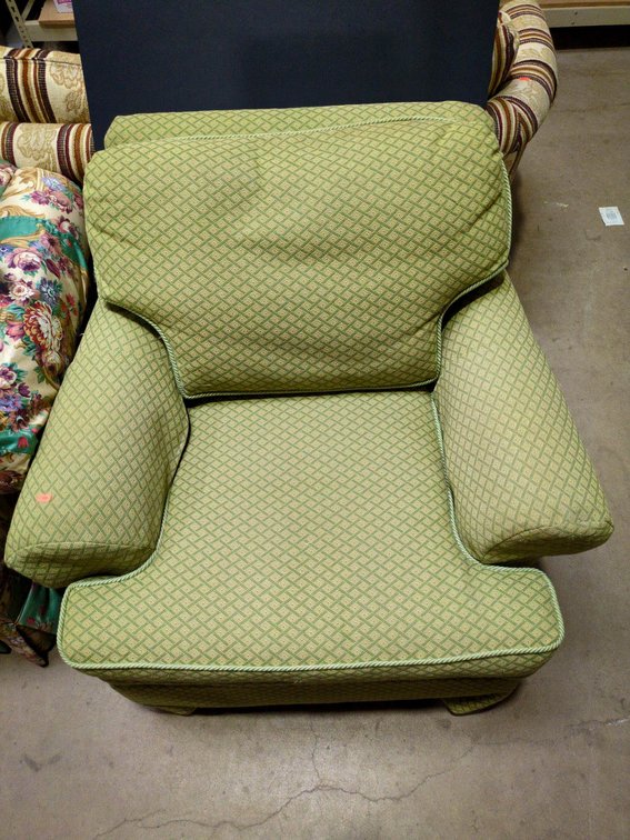 Green Upholstered Armchair with Skirted Base
