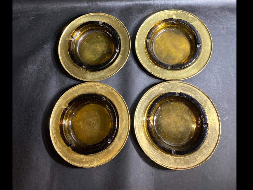 Four Amber Glass Ashtrays with Gold-Toned Rims