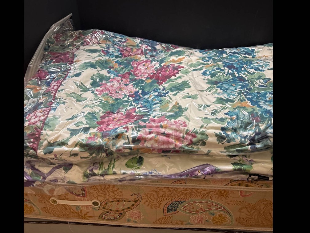 Two Floral Pattern Comforters with Plastic Covers