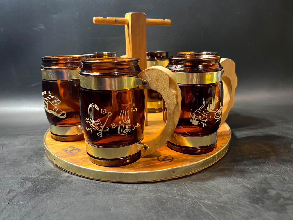 6 Amber Glass Mugs with Metal Handles on Wooden Carousel