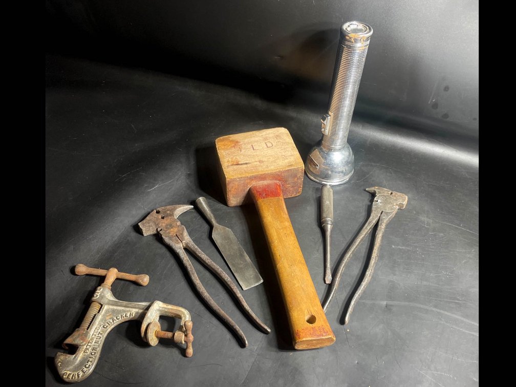 Vintage Hand Tools Including Mallet, Flashlight, and Pliers
