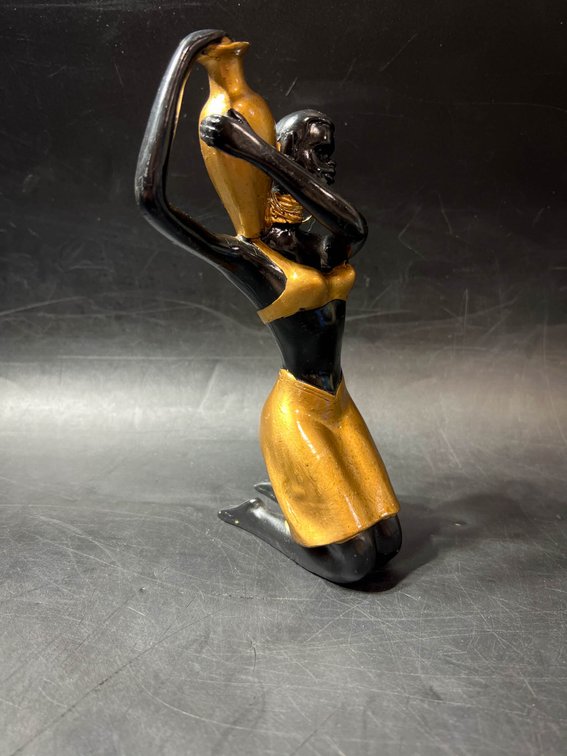 Black and Gold Kneeling Woman Figurine Holding a Vase