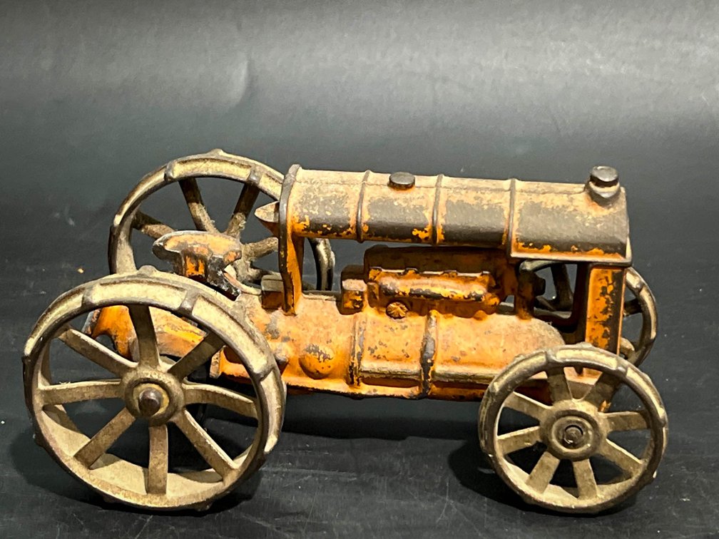Cast Iron Toy Tractor with Orange Paint