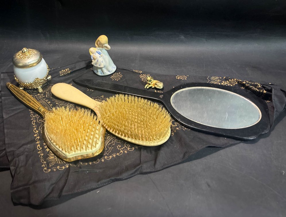 Vanity Items Including Brushes, Hand Mirror, Figurine, and Perfume Jar