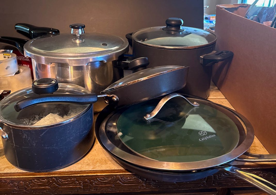 Pressure Cooker and Assorted Skillets, Including One Without a Lid