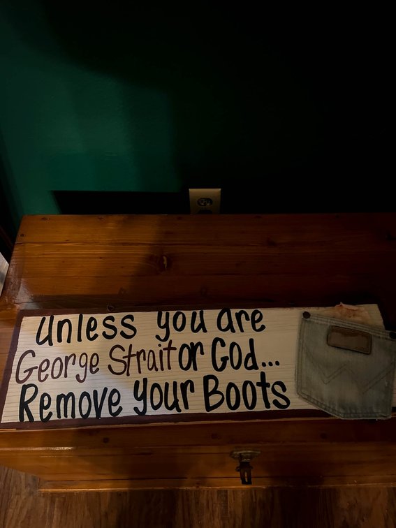 Wooden Sign with Humorous Boots Message and Denim Pocket Accent