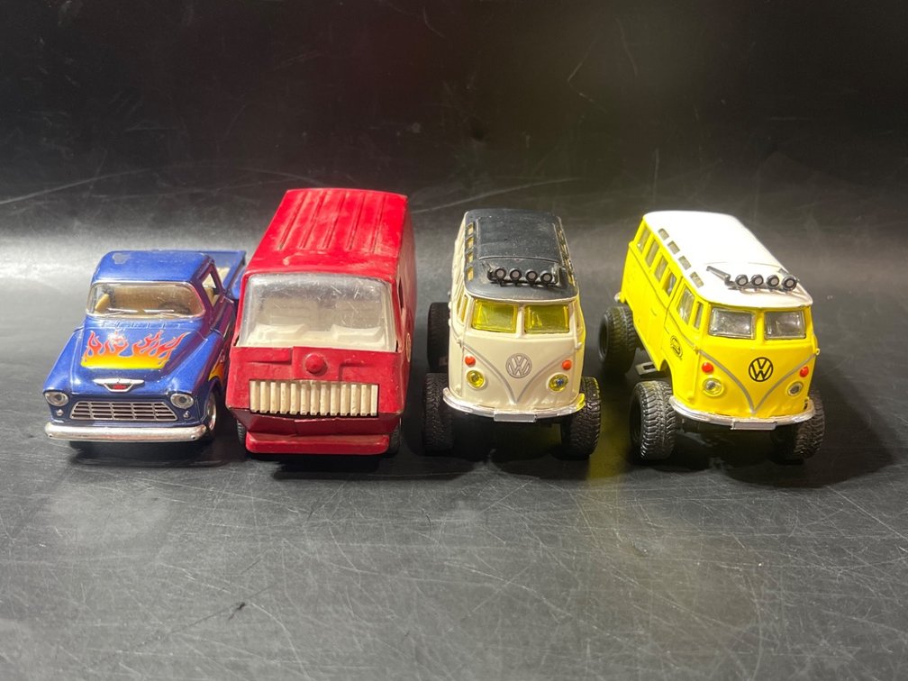 Four Die-Cast Toy Vehicles, Including Vans and Pickup