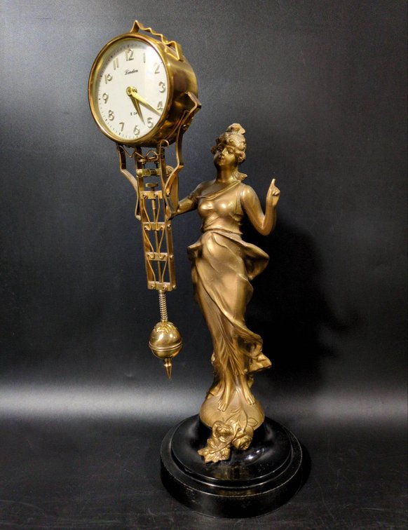 Linden 8-Day Clock with Spelter Figurine on Black Base