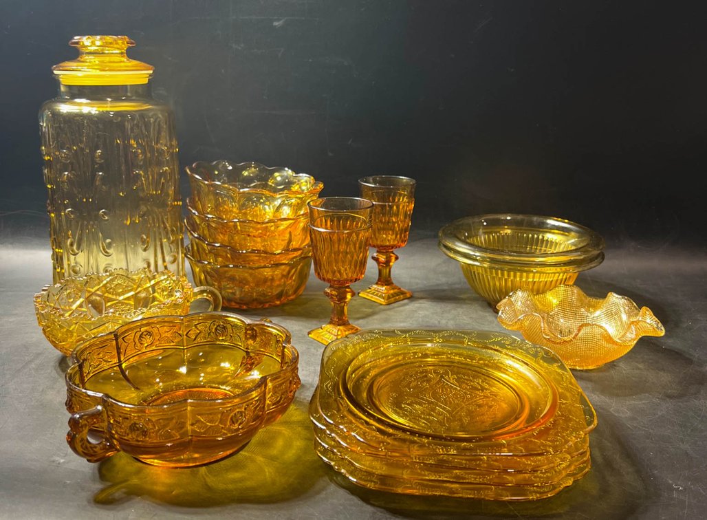 Amber Glassware Including Plates, Bowls, and Drinkware