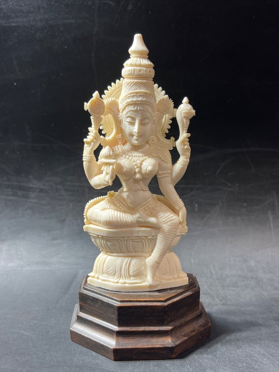 Carved Hindu Goddess Figurine on Wooden Base