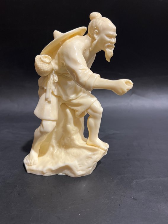 Ivory-Colored Figurine of a Man with Traditional Attire, 7 Inches Tall