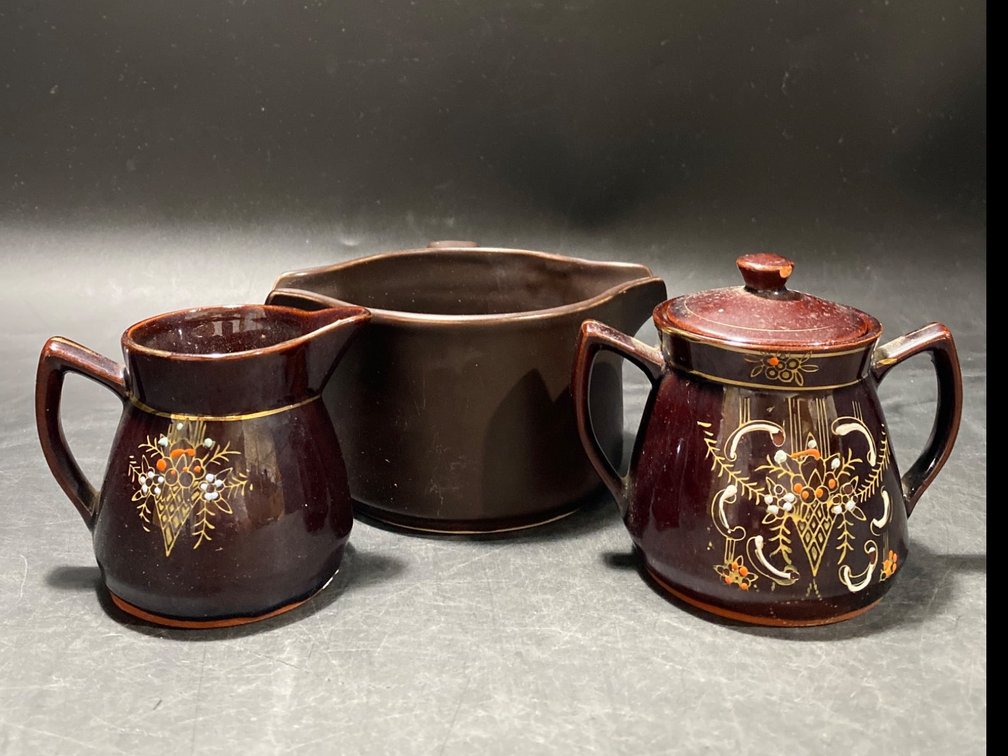 Three Ceramic Pieces Including Creamer, Sugar Bowl, and Lipped Pot