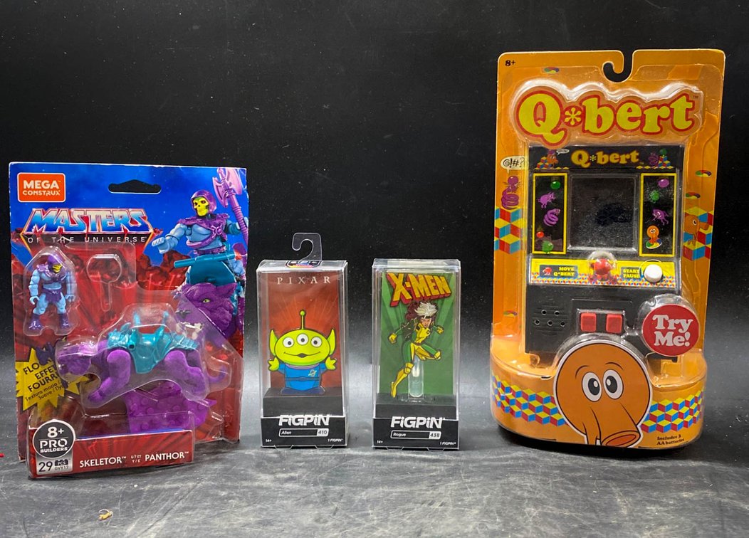 Toys Including Masters of the Universe, FigPins, and Q*Bert Game