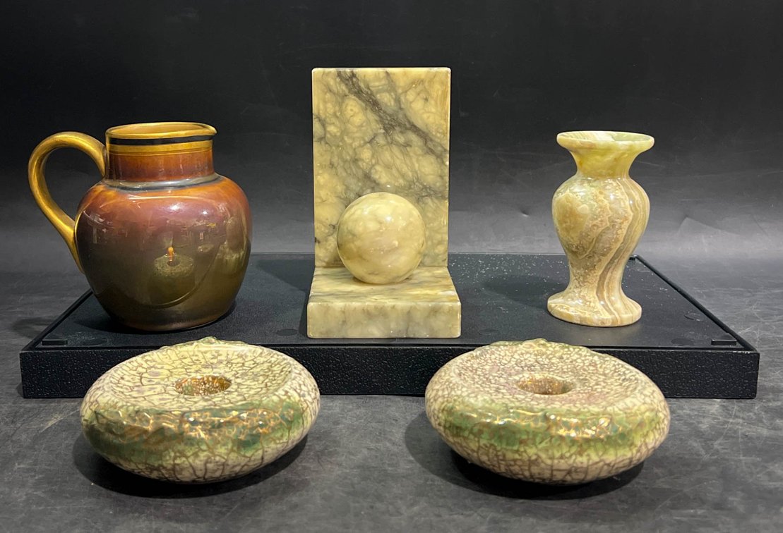 Decorative Items Including Marble Sculptures, Pottery Vase, and Ceramic Doughnut Forms