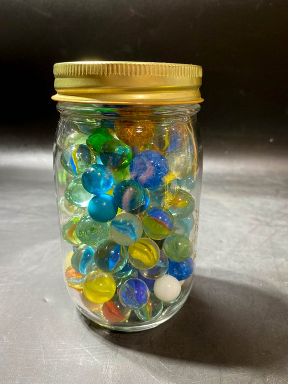 Jar of Assorted Glass Marbles in Various Colors