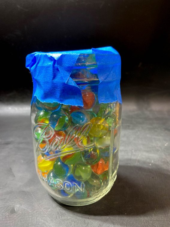 Ball Mason Jar Filled with Multicolored Glass Marbles