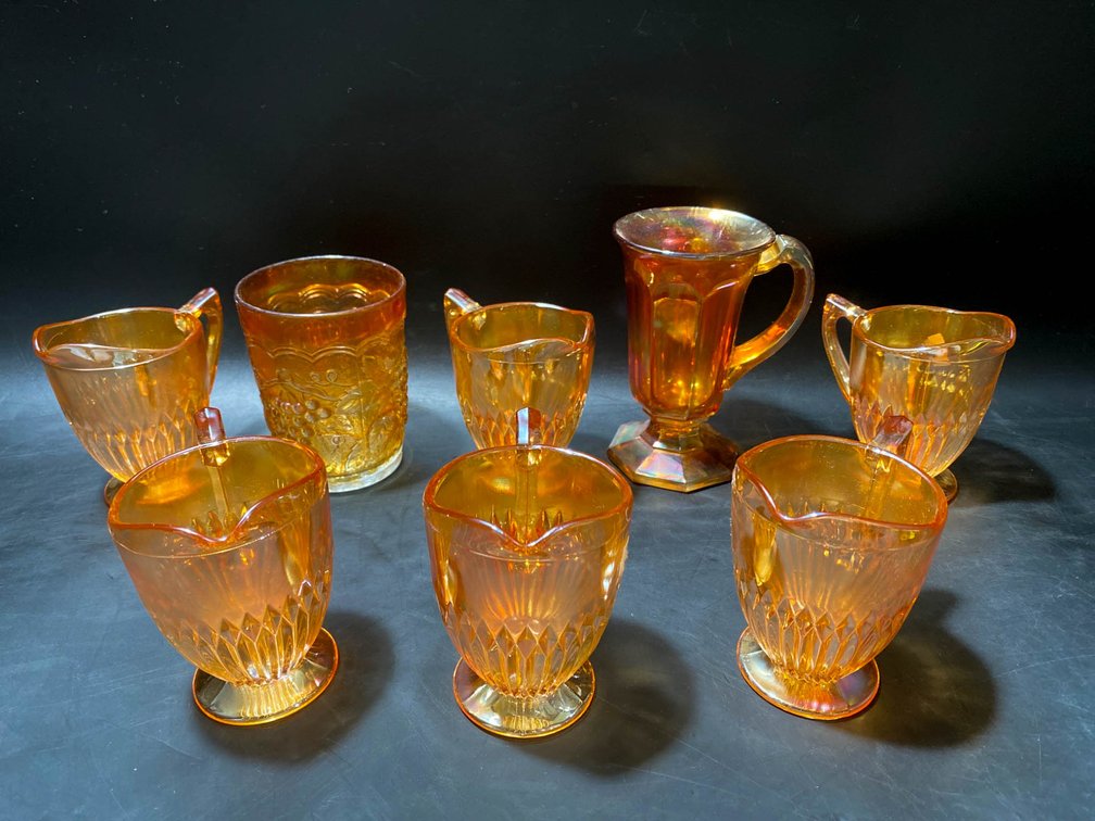 Amber-Colored Carnival Glass Pitchers and Glassware
