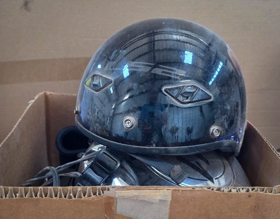 Motorcycle Accessories Including Helmets and Battery Charger