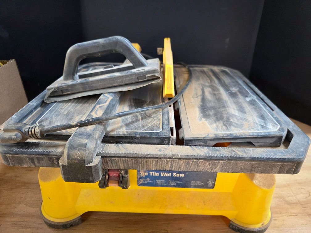 Yellow 7-Inch Tile Wet Saw with Attached Accessories