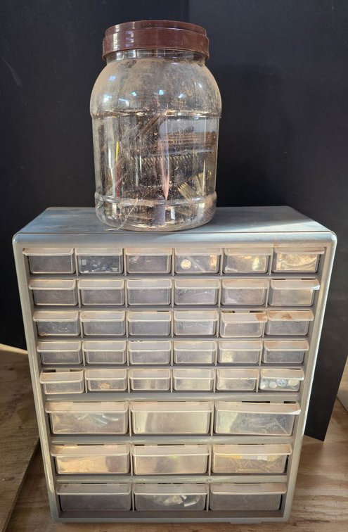 Metal Storage Cabinet with Plastic Drawers and Jar of Nails