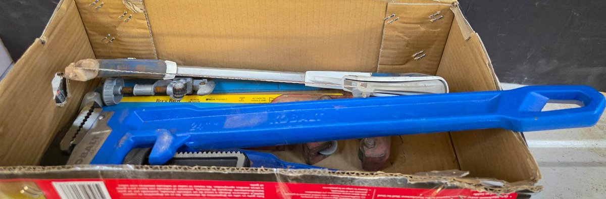 Hand Tools Including Pipe Wrenches, Hacksaw, and Pipe Cutters