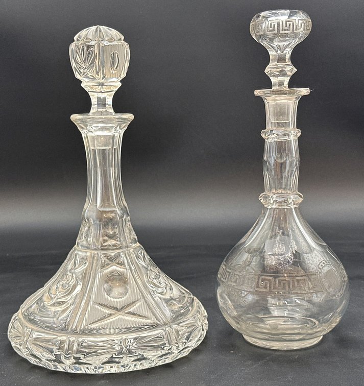 Clear Glass Decanters with Stoppered Lids and Decorative Detailing