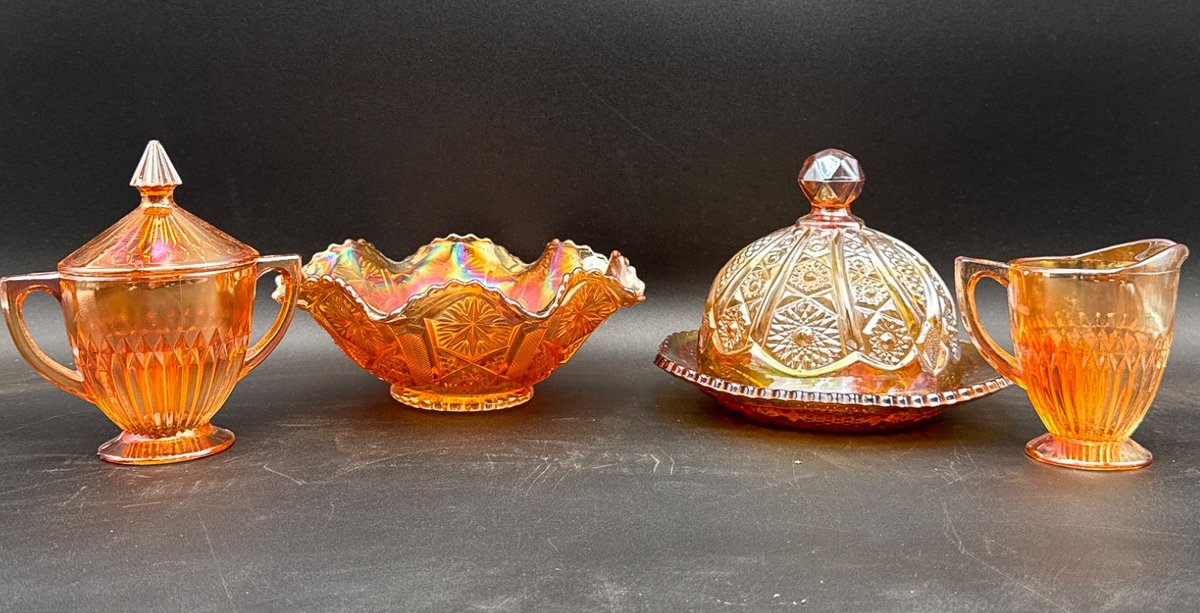 Marigold Carnival Glass Bowls, Butter Dish, and Creamer with Lid