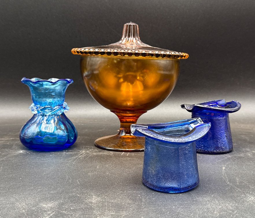 Amber Glass Lidded Compote and Assorted Blue Glass Items
