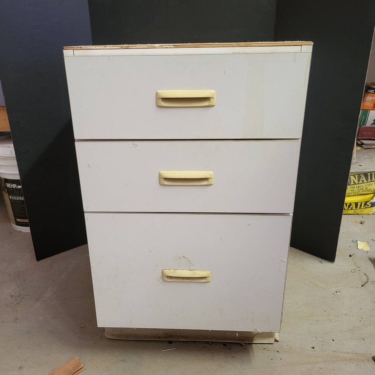 White Three-Drawer Storage Cabinet with Yellow Handles