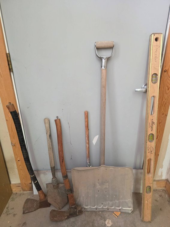 Tools Including a 4ft Wooden Level and Various Hand Tools