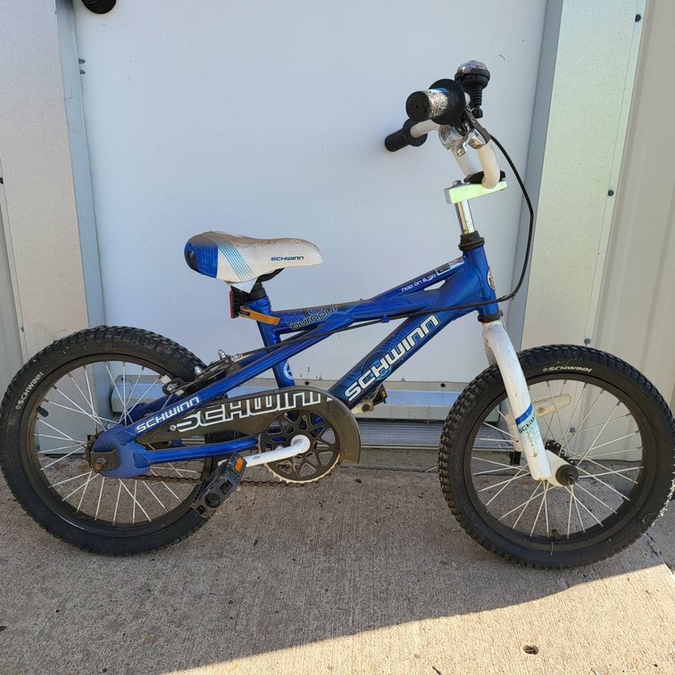 Two Bicycles: Schwinn Kids Bike and Red Adult Mountain Bike