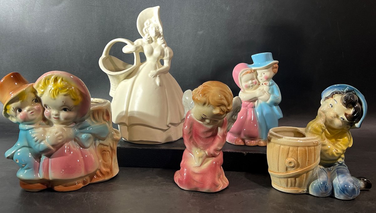 Ceramic Figurines Featuring Children and a Victorian Woman