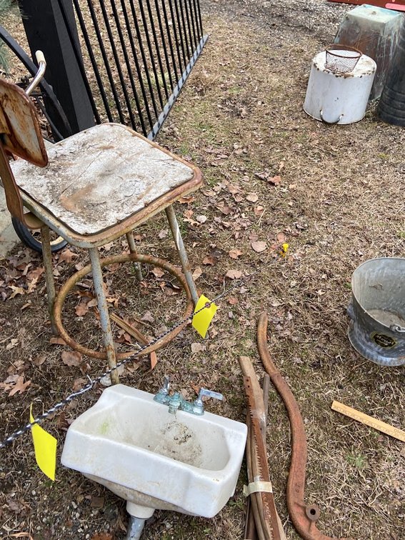 White metal stool, White sink, Wagon harness and saw