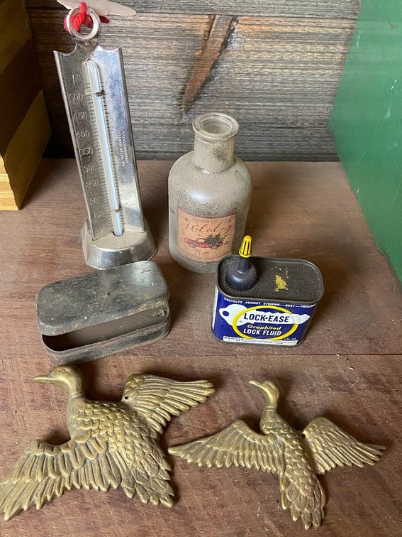 Ideal Thermometer,  brass duck wall hangings,  metal Lock-E can, hinged metal box, & a glass bottle