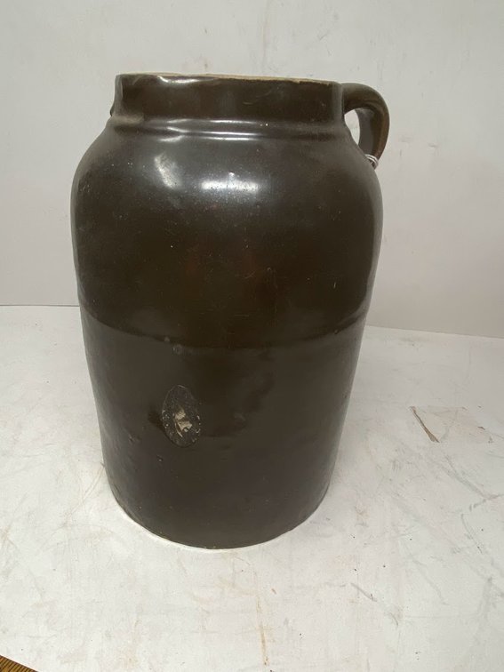 Brown Crock Stoneware, with a small imperfection on the side of the jug