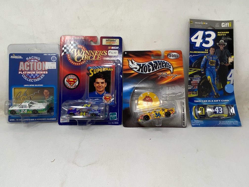Action: Racing Collectable Platinum Series, Jack Sprague Scale 1:64, Winner's Circle Jeff Gordon Diecast Car Scale 1:64, Hot Wheels Racing Pit Board M&M's 1:64 Scale, and Richard Petty 1:64 Scale 