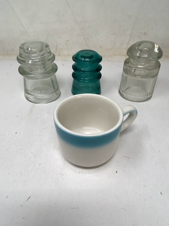 Insulators: 1- Green and 2- Clear, and Coffee mug