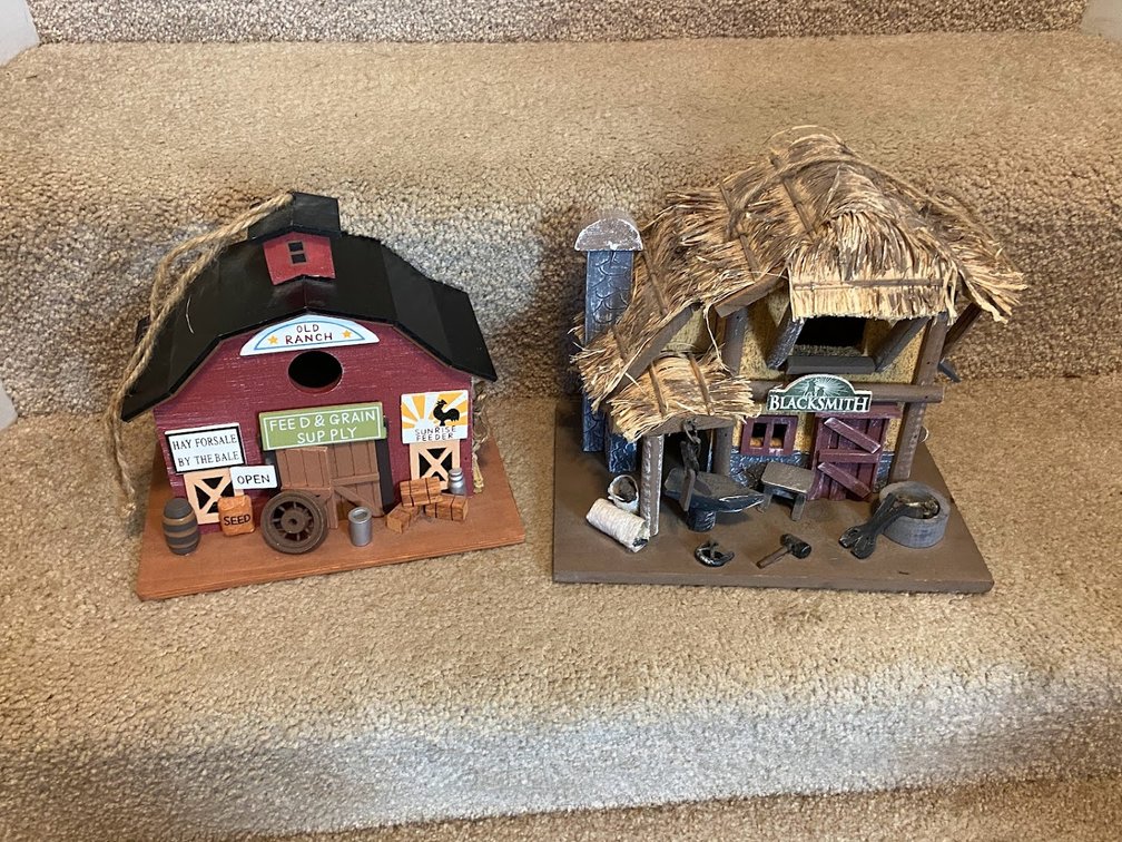 Two decorated birdhouses.