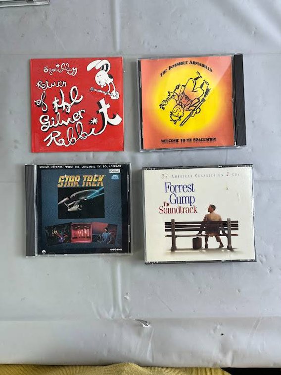 4 Music CDs: Forrest Gump Soundtrack, Star Trek, Invisible Armadillo, and Return of The Silver Jubilee