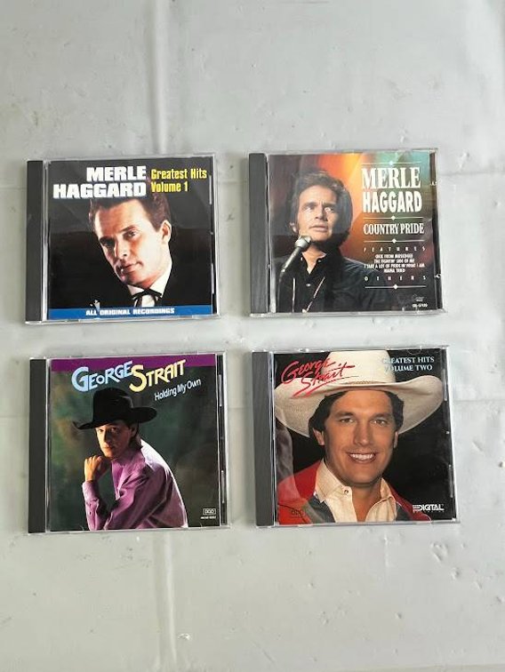 Four Country Music CDs By Merle Haggard and George Strait