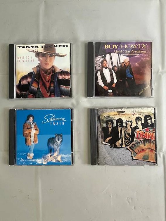 Four Country and Rock Music CDs
