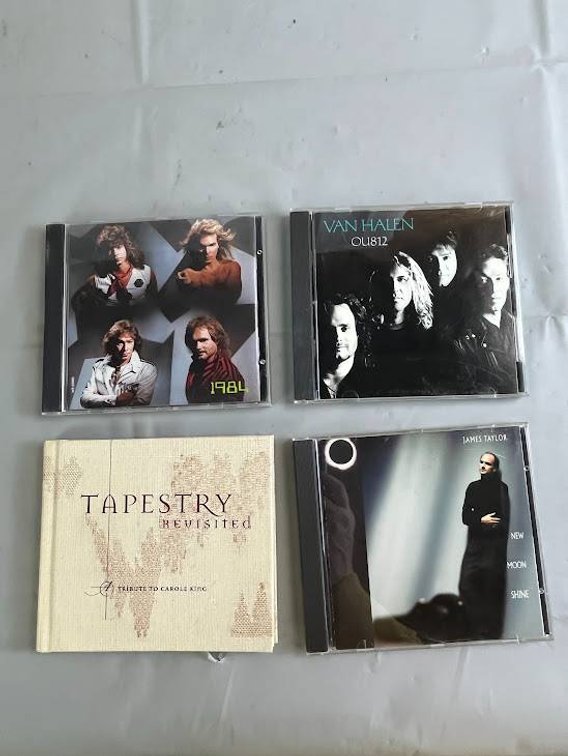 Four Music CDs Including Van Halen, James Taylor, and More