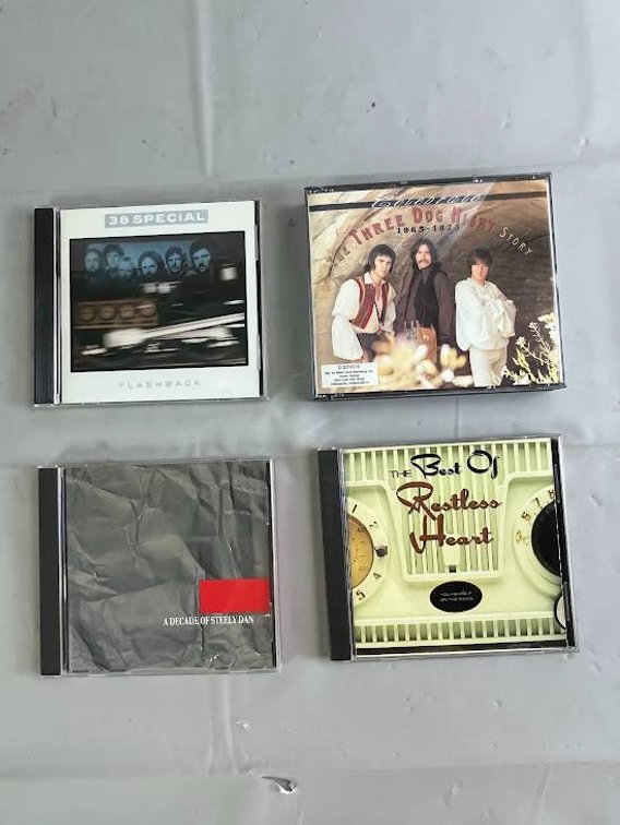 4 Music CDs Including 38 Special, Three Dog Night, Restless Heart, and Steely Dan