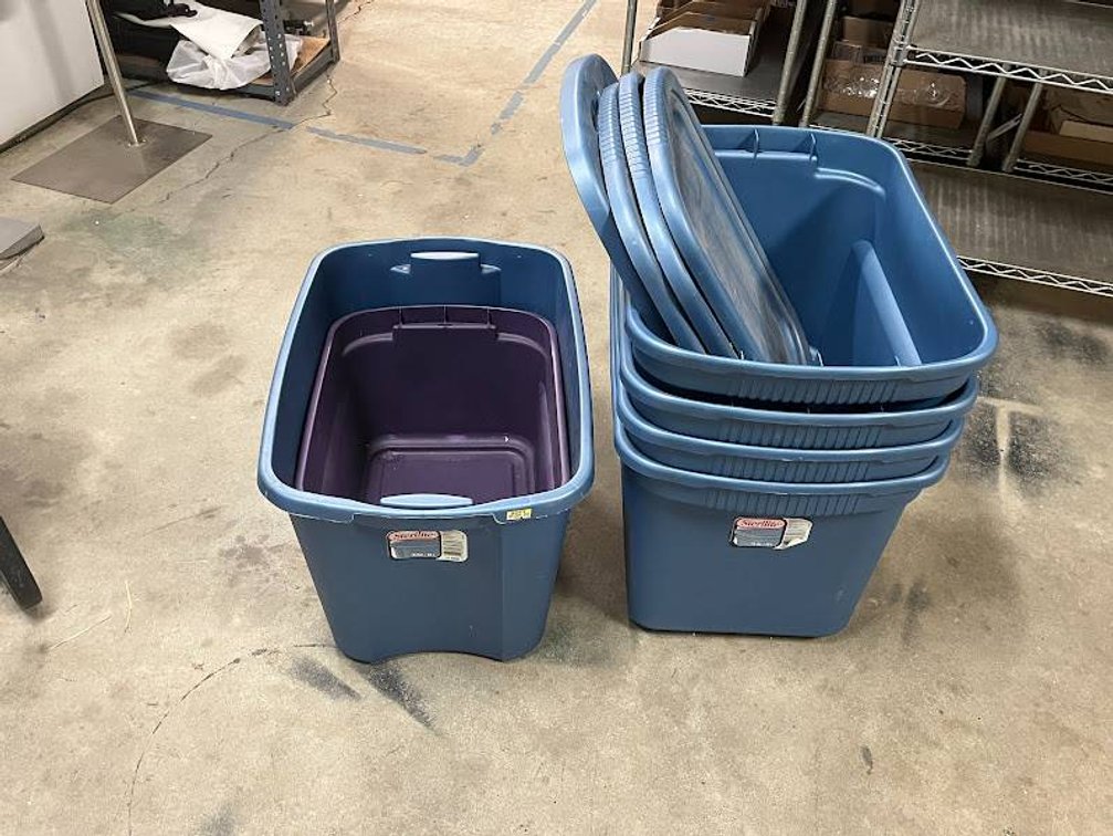 Stack of Blue Plastic Storage Bins with Lids, Some Missing Lids