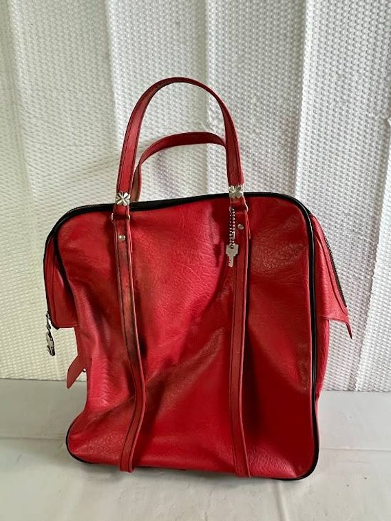 Red Leather Handbag with Dual Handles and Zip Closure