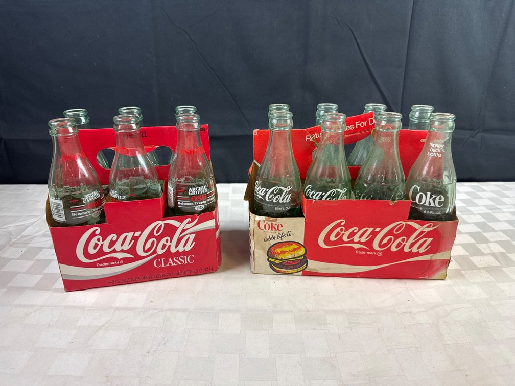 Two Sets of Coca-Cola Collectible Glass Bottles in Original Packaging