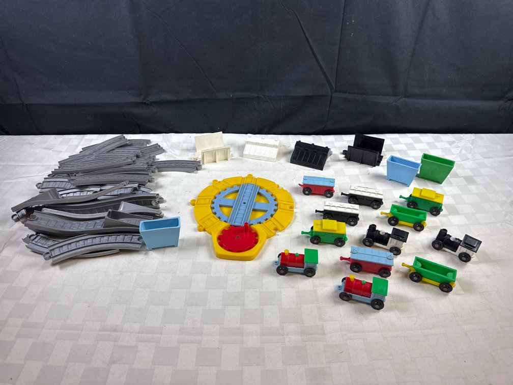 Plastic Train Set With Tracks, Engines, and Accessories