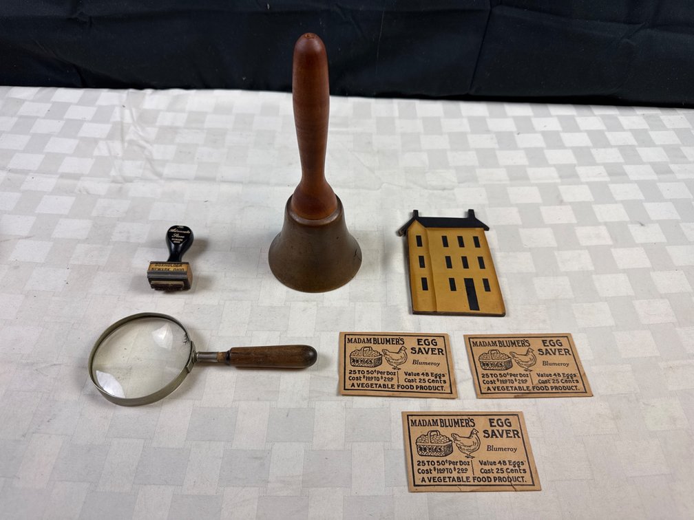 Vintage Items Including Bell, Stamp, Magnifier, and Ephemera